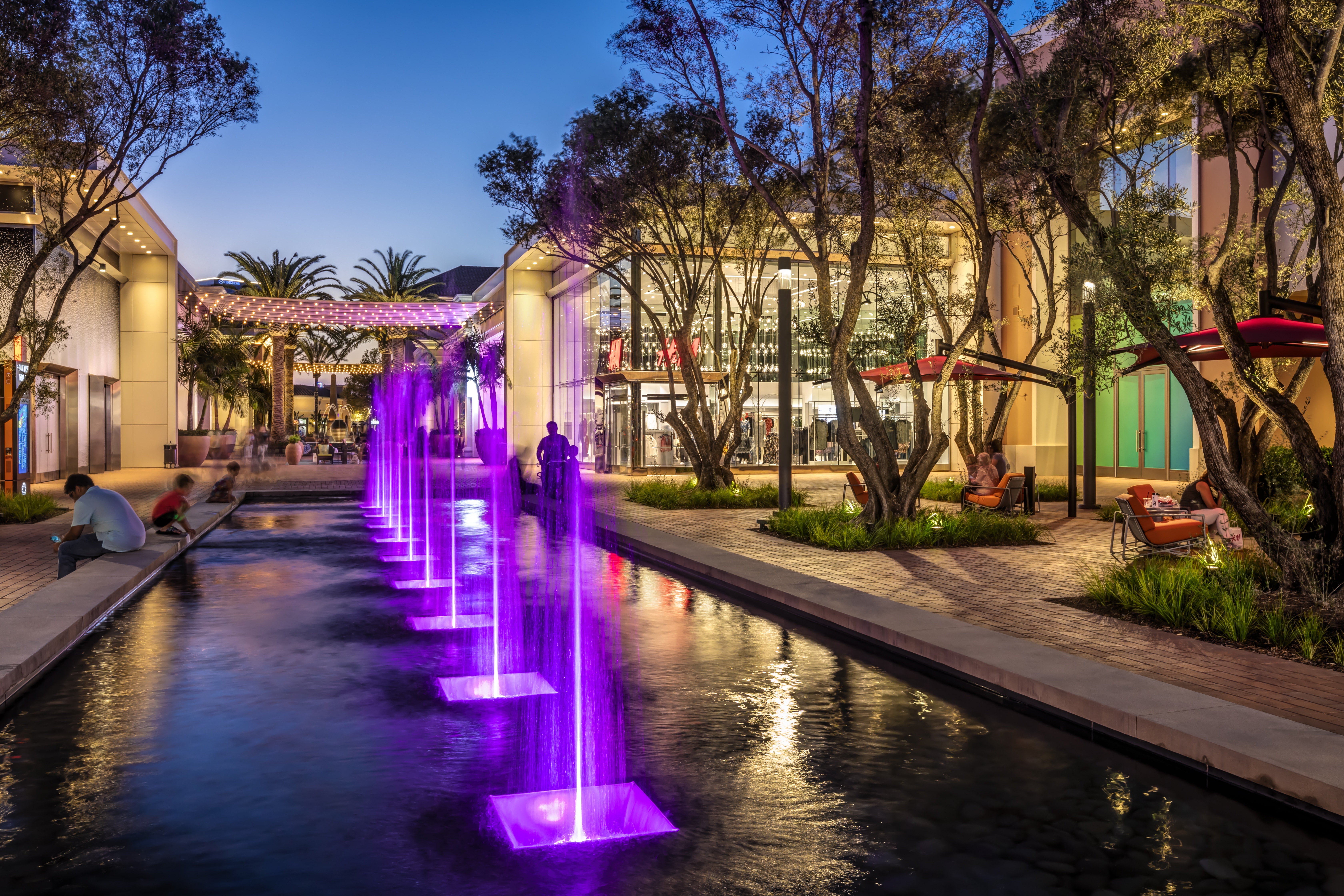Evening photo of Irvine Spectrum Center outdoor shopping mall