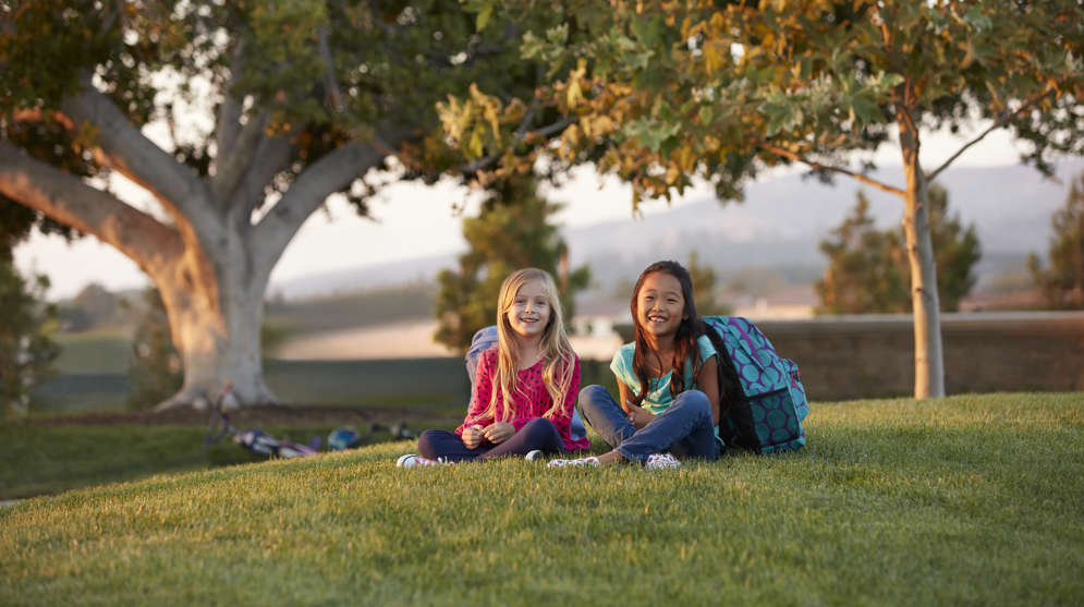 Girls with backpacks in Park